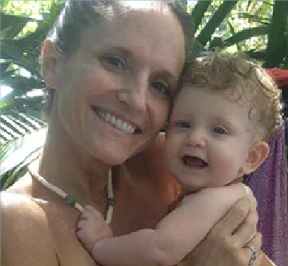 Founder of LuvBelly prenatal powder poses with her baby.